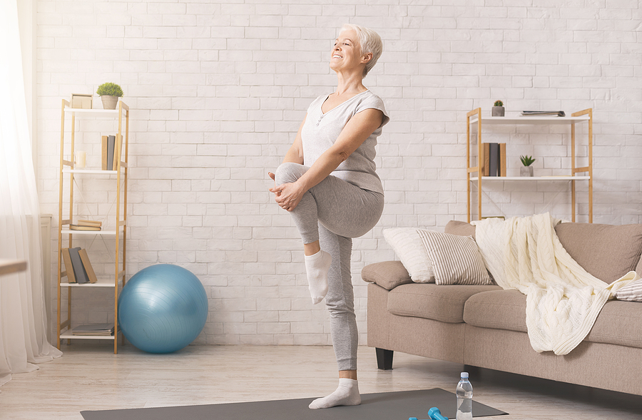 Premium Photo  Pregnant female holding smartphone while sitting on  exercise yoga mat at home at coronavirus time